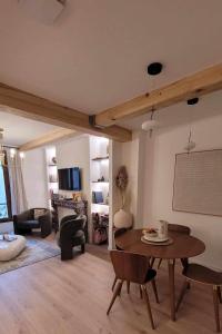 a living room with a table and chairs at Verdon - Appartement d'Architecte in Comps-sur-Artuby