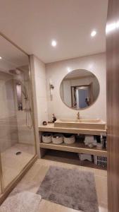 a bathroom with a tub and a sink and a mirror at Verdon - Appartement d'Architecte in Comps-sur-Artuby