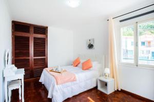 Uma cama ou camas num quarto em Dream Paradise