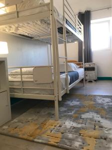 Cama ou camas em um quarto em My Hostel