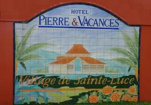 Ein Zertifikat, Auszeichnung, Logo oder anderes Dokument, das in der Unterkunft VUE MER Site paradisiaque Superbe décoration ausgestellt ist