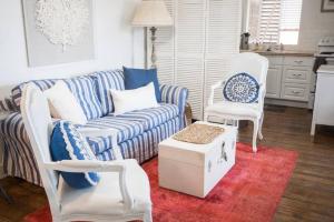 a living room with a couch and two chairs at The Danish Nydam - A Sailors Mooring in Christiansted