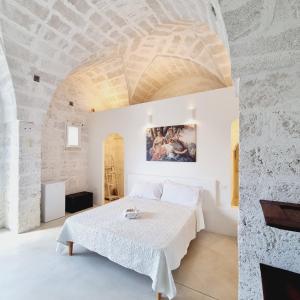 Postel nebo postele na pokoji v ubytování Corte Mercurio B&B