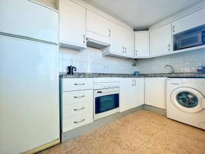 Kuchyň nebo kuchyňský kout v ubytování Ático Blaumar Vistas al mar by Hugo Beach