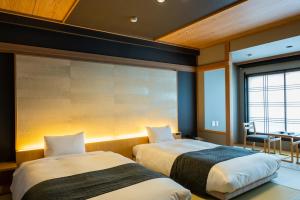 Voodi või voodid majutusasutuse Ito Kowakien toas