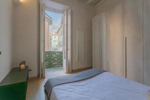 Posteľ alebo postele v izbe v ubytovaní Wine Not Apartment in Como City Centre