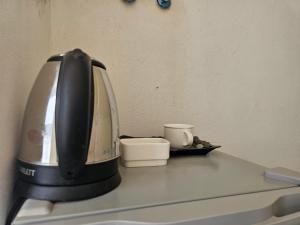 a coffee maker sitting on top of a counter at Sama Rum Camp in Wadi Rum