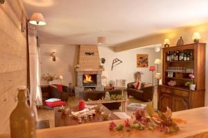 a living room with a fireplace and a couch at Chalet de 5 chambres avec wifi a Aime a 1 km des pistes in Aime-La Plagne