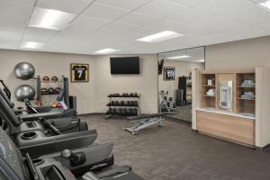 a gym with treadmills and machines in a room at Residence Inn by Marriott Orlando East/UCF Area in Orlando