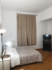 Postel nebo postele na pokoji v ubytování Residence Vanvitelli
