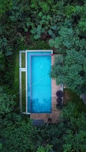 an overhead view of a blue door on a wooden deck at Area 4 eco cubes in Ella