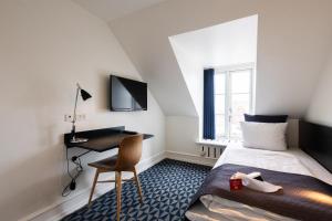TV i/ili multimedijalni sistem u objektu Milling Hotel Ritz Aarhus City
