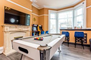 a billiard room with a pool table and a tv at Room 03 - Sandhaven Rooms Double in South Shields