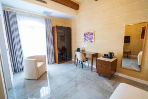 L-Eremita Boutique Hotel客房内的一张或多张床位