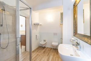 a bathroom with a shower and a sink and a toilet at Chianti Classico Home in Castellina in Chianti +34 photos