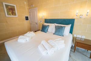 L-Eremita Boutique Hotel客房内的一张或多张床位