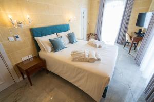 L-Eremita Boutique Hotel客房内的一张或多张床位