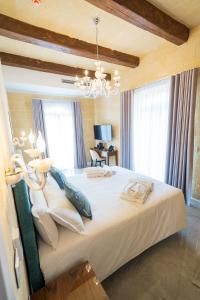 L-Eremita Boutique Hotel客房内的一张或多张床位