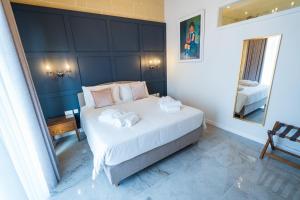 L-Eremita Boutique Hotel客房内的一张或多张床位