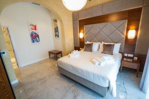 L-Eremita Boutique Hotel客房内的一张或多张床位