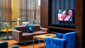 TV a/nebo společenská místnost v ubytování Cettia Beach Resort