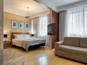 Cama ou camas em um quarto em Mercure Belo Horizonte Savassi