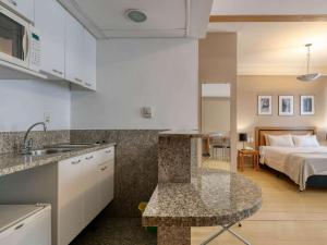 Cama ou camas em um quarto em Mercure Belo Horizonte Savassi