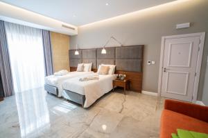 L-Eremita Boutique Hotel客房内的一张或多张床位
