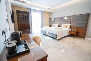 L-Eremita Boutique Hotel客房内的一张或多张床位