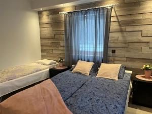 Postel nebo postele na pokoji v ubytování Luguse Älfi Maja