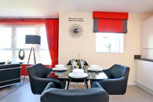 a living room with a dining room table and chairs at Trendy apartment a short drive from Aberdeen City in Aberdeen