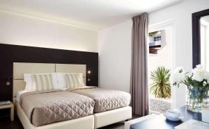 Postel nebo postele na pokoji v ubytování Hydra Beach Resort