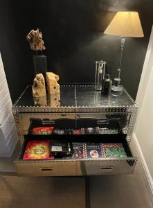 a drawer with a lamp on top of it at 3-storey luxury Georgian house, High St, Henley-in-Arden in Henley in Arden