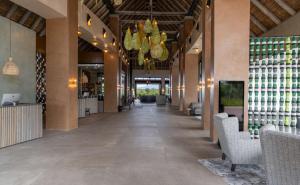 a hallway of a restaurant with a ceiling at Radisson Safari Hotel Hoedspruit in Hoedspruit