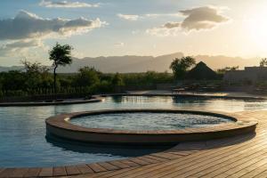a swimming pool with a circle in the middle at Radisson Safari Hotel Hoedspruit in Hoedspruit