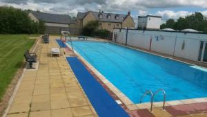 a large blue swimming pool on top of a building at Victorian Woodstock in Cape Town