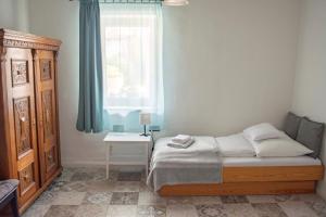 a bedroom with a bed and a window at Marelle Porta in Veresegyház +12 photos