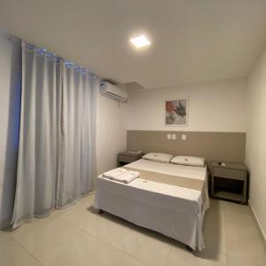 Postel nebo postele na pokoji v ubytování Onix Hotel Praia de Piata