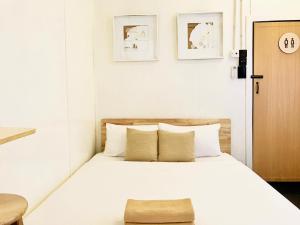 Ένα ή περισσότερα κρεβάτια σε δωμάτιο στο RUMAPOKO Guesthouse