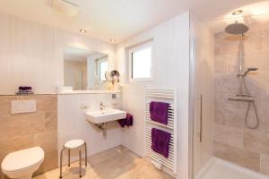 a bathroom with a sink toilet and a shower at Sportpension Rubin in Sölden +70 photos