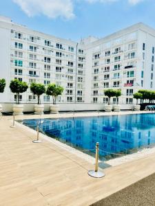 a large apartment building with a large swimming pool at The Royal Residency Suites,Lucknow Gomti Nagar in Lucknow