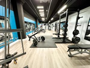 a gym with several treadmills and machines in it at McCormick Place city with view 2br-2ba with Optional parking that sleeps up to 6 in Chicago