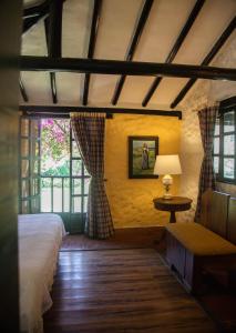 Ένα ή περισσότερα κρεβάτια σε δωμάτιο στο Casa San Nicolas
