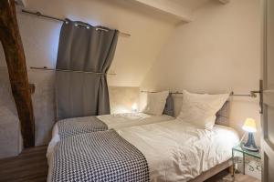 Postel nebo postele na pokoji v ubytování Gîte Jeanne D'Arc + 17 fotografií