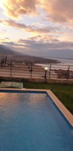 a large swimming pool with a view of the ocean at فلل التن تاج ALTINTAC villalari in Sapanca