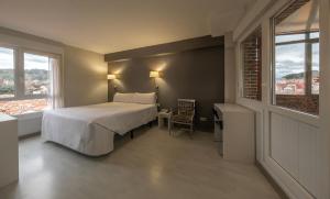 Postel nebo postele na pokoji v ubytování Hotel Bilbi