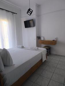 Postel nebo postele na pokoji v ubytování Galini Apartments