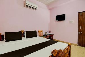 Postel nebo postele na pokoji v ubytování Hotel O Mahalaxmi lodge + 37 fotografií