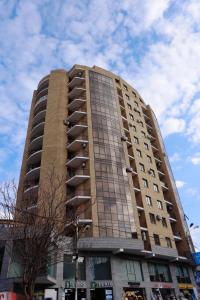 a tall building with balconies on the side of it at Apartment in centre of Yerevan in Yerevan