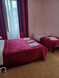 Posteľ alebo postele v izbe v ubytovaní B&B Appartamenti NAPOLI